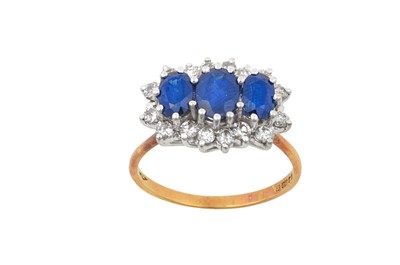 Lot 2118 - An 18 Carat Gold Sapphire and Diamond Cluster...