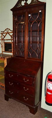 Lot 788 - A 19th century mahogany bureau bookcase with associated top