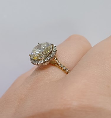 Lot 2316 - A Diamond Cluster Ring the round brilliant cut...