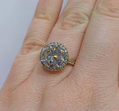 Lot 2316 - A Diamond Cluster Ring the round brilliant cut...