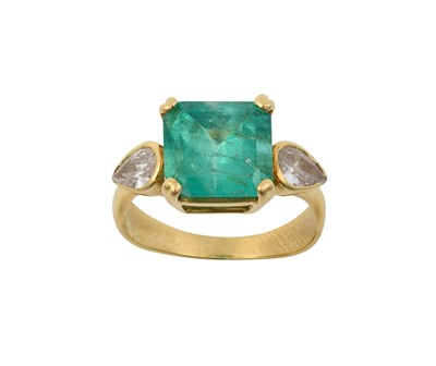 Lot 2228 - An Emerald and Diamond Three Stone Ring the...