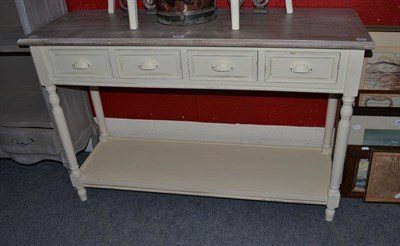 Lot 808 - Shabby chic cream painted dresser base with three drawers and under tier