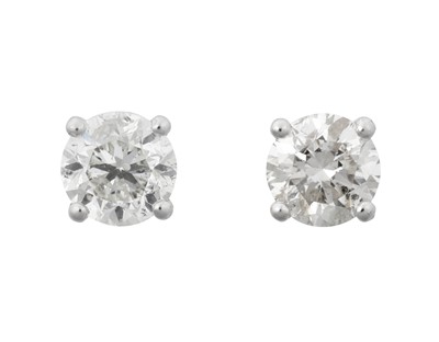 Lot 2218 - A Pair of Diamond Solitaire Earrings the round...