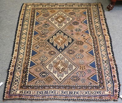 Lot 1111 - Luri Rug, the faded lilac field with three...