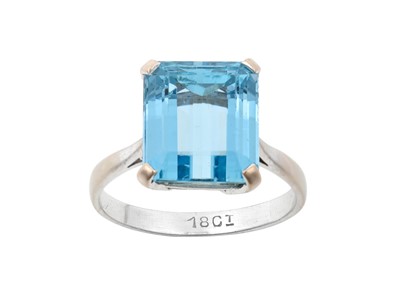 Lot 2266 - An Aquamarine Ring the emerald-cut aquamarine...