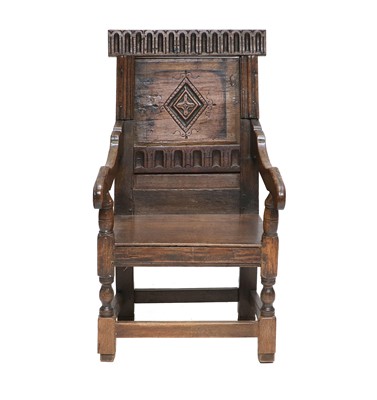 Lot 659 - A Joined Oak Armchair, the nulled and carved...