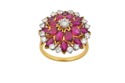 Lot 2144 - A Ruby and Diamond Cluster Ring the central...