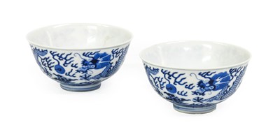 Lot 139 - A Pair of Chinese Porcelain “Dragon” Bowls,...