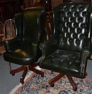 Lot 865 - Two leather executive swivel chairs