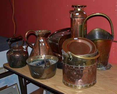 Lot 876 - A large quantity of assorted copper to include kettles, fire extinguisher jugs, warming pan etc