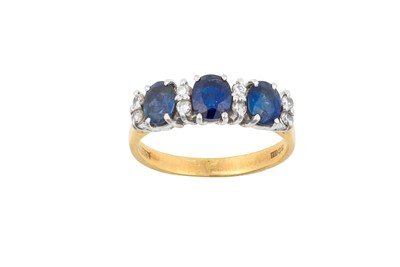 Lot 2113 - An 18 Carat Gold Sapphire and Diamond Ring...