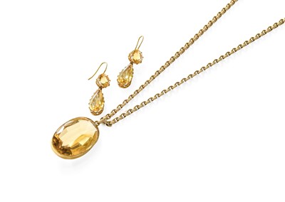 Lot 430 - A Citrine Pendant on Chain, the oval cut...