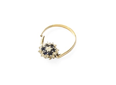 Lot 428 - A Sapphire and Diamond Cluster Ring, the...