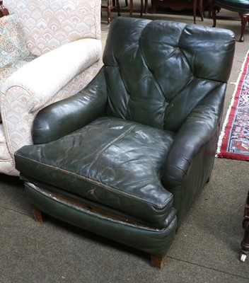 Lot 1348 - A Green Leather Club Armchair, in the Howard &...