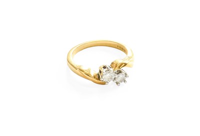 Lot 483 - An 18 Carat Gold Diamond Two Stone Twist Ring,...