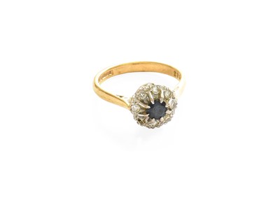 Lot 521 - An 18 Carat Gold Sapphire and Diamond Cluster...