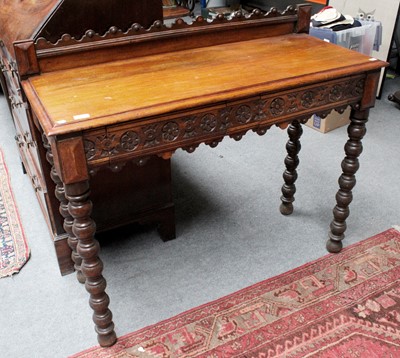 Lot 1204 - A Victorian Carved Oak Hall Table, undulating...