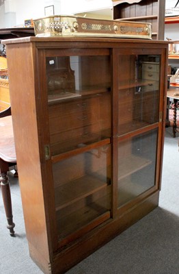 Lot 1323 - An Oak School Room Bookcase, with glazed...