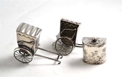 Lot 57 - Pair of sterling silver novelty pepperettes modelled as rickshaws and a Continental box (3)