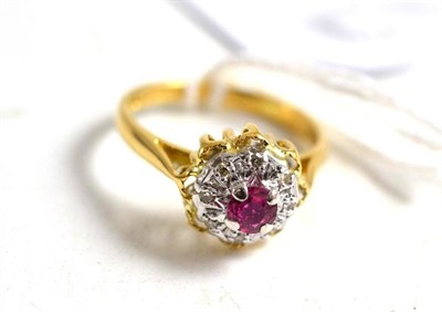 Lot 61 - A 18ct gold ruby and diamond cluster ring