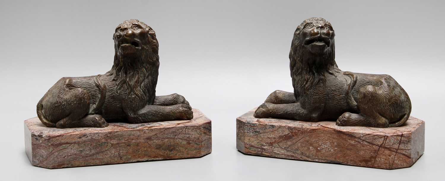 Lot 296 - A Pair of Bronzed Recumbent Lions, on...