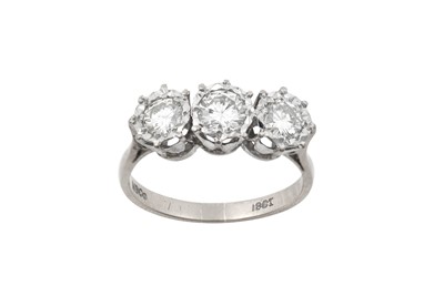 Lot 2119 - A Diamond Three Stone Ring the graduated round...