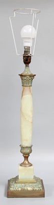 Lot 1360 - A Green Onyx and Gilt Metal Mounted Table Lamp