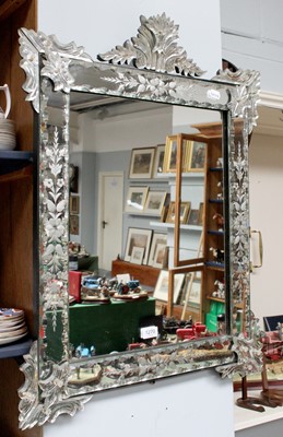 Lot 1249 - A Venetian Style Wall Mirror, with scroll...