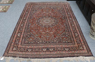 Lot 1211 - Kashmir Carpet, the brick red field with a...