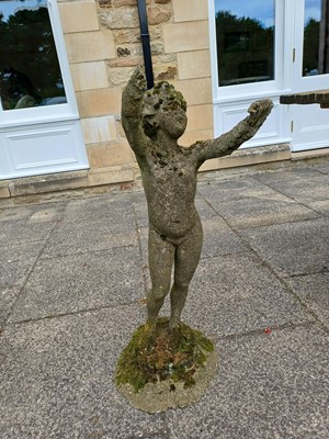 Lot 1185 - A Weathered Composition Garden Statue of a...