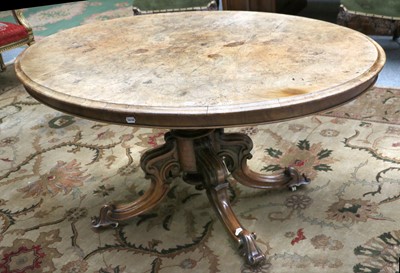 Lot 1427 - A Victorian Walnut Loo Table, on four carved...