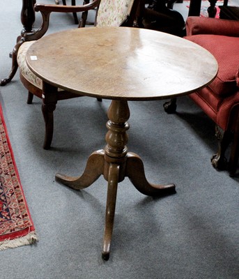 Lot 1279 - A 19th Century Oak Tripod Table, circular tilt-...