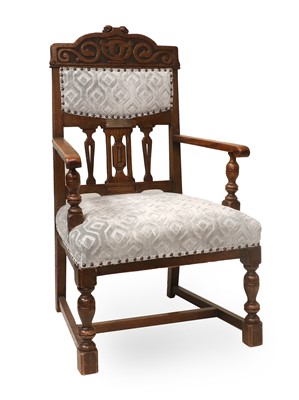 Lot 1337 - An Early 20th Century Carved Oak Open Armchair,...