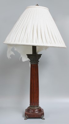 Lot 1372 - A Patinated Metal Mounted Wooden Table Lamp,...