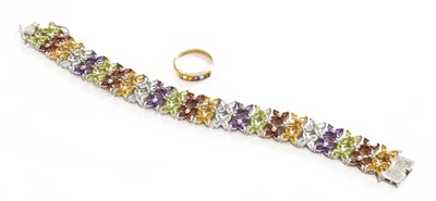 Lot 526 - A 9 Carat Gold Multi-Gem Set Ring, the calibré...