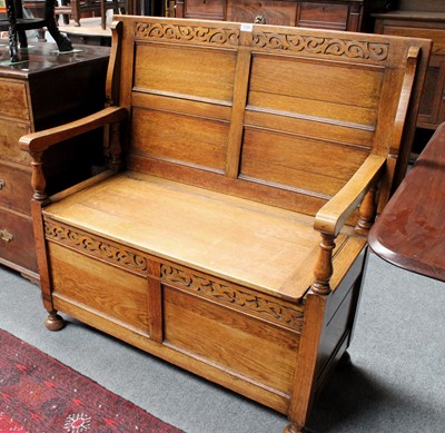 Lot 1326 - An Early 20th Century Carved Oak Monks Bench,...