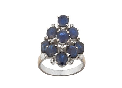 Lot 2109 - A Sapphire and Diamond Ring nine oval cut...