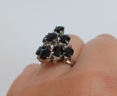 Lot 2109 - A Sapphire and Diamond Ring nine oval cut...