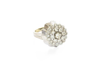 Lot 520 - A Diamond Cluster Ring, the central raised...