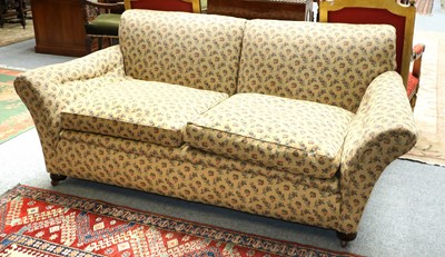 Lot 1418 - A Two-Seater Sofa, with outscrolled arms and...