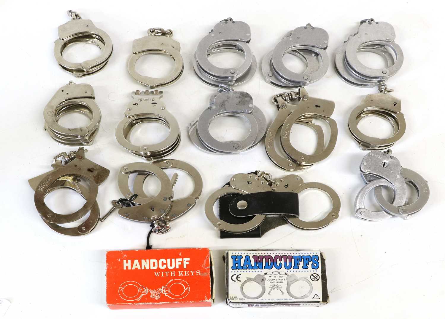 Hand Cuffs Click Lot 135 - Sixteen Pairs of Handcuffs, including three