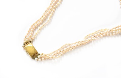 Lot 302 - A Triple Row Cultured Pearl Necklace, the...