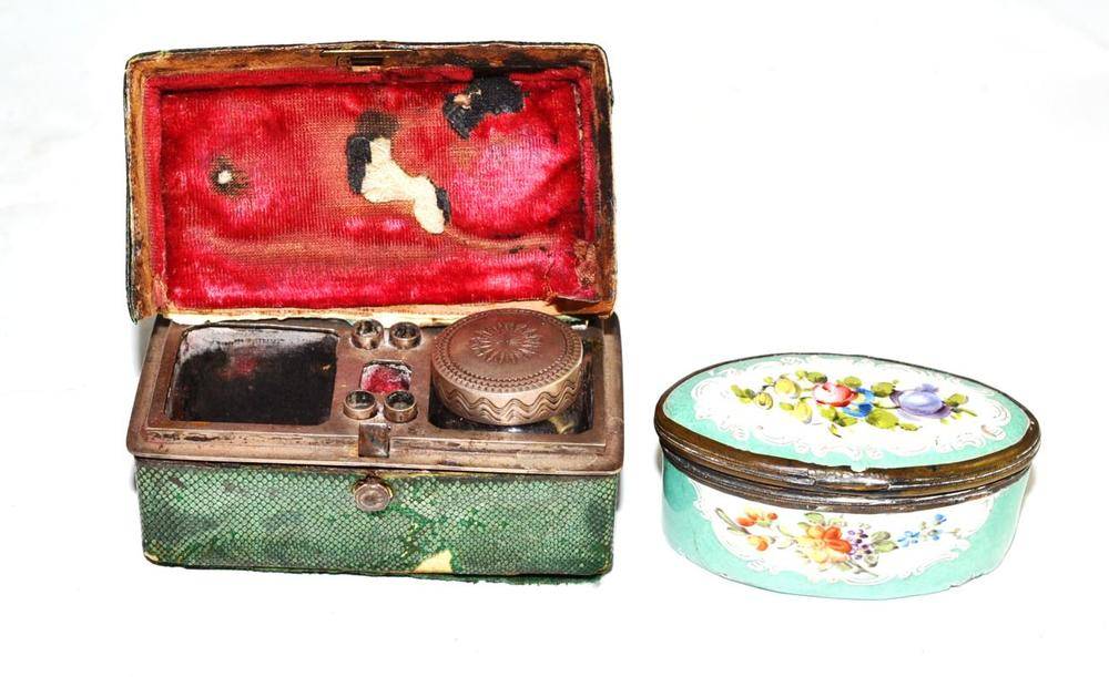 Lot 203 - 19th century oval enamel decorated hinged patch box and cover and shagreen cased travel inkwell (2)
