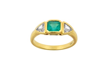 Lot 2128 - An Emerald and Diamond Three Stone Ring the...