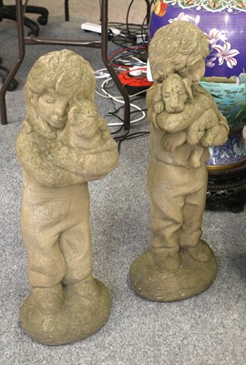 Lot 1199 - Two Weathered Composition Garden Statues, of a...