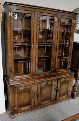 Lot 1273 - A Titchmarsh & Goodwin Style Oak Bookcase, the...