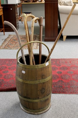 Lot 1429 - A Coopered Oak Barrel, together with walking...