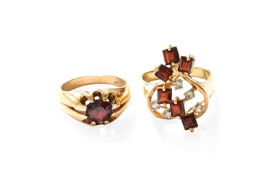 Lot 455 - A Garnet and White Sapphire Cluster Ring, set...