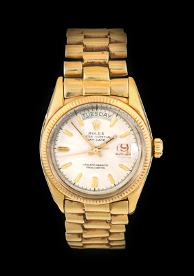 Lot 2138 - Rolex: A Rare 18 Carat Gold Automatic Day/Date...