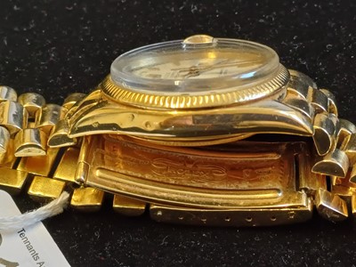 Lot 2138 - Rolex: A Rare 18 Carat Gold Automatic Day/Date...
